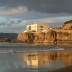 Historic multi-story Victorian Cliff House in San Francisco overlooking Ocean Beach in the late nineteenth century