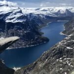The top of the famous Trolltunga cliff overlooking Lake Ringedalsvatnet in Norway.