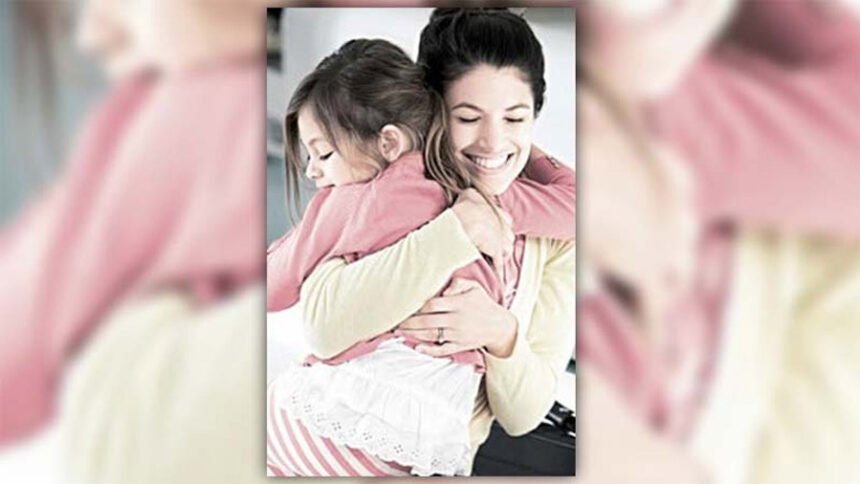 A loving parent hugs a young child before bedtime in a cozy bedroom environment, with dim lighting and no screens.