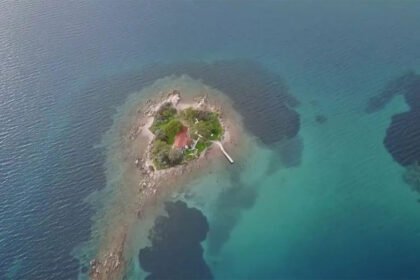 Aerial view of Daskalio islet near Keros, Greece, showing its natural pyramid shape and ancient stone terraces