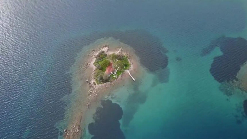 Aerial view of Daskalio islet near Keros, Greece, showing its natural pyramid shape and ancient stone terraces
